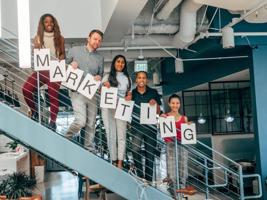 Marketing team standing in a office.



